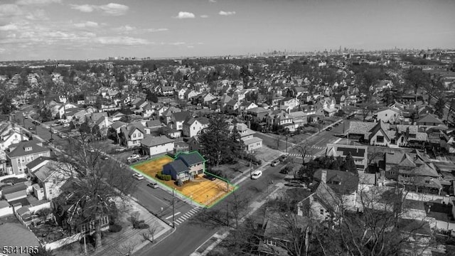 birds eye view of property with a residential view