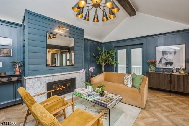 living area featuring high vaulted ceiling, a fireplace, french doors, beamed ceiling, and an inviting chandelier