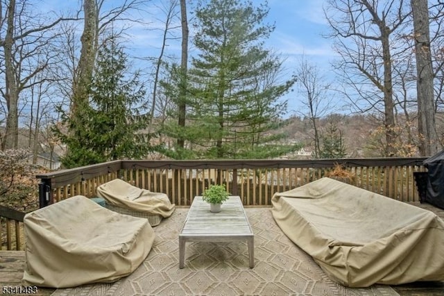 wooden deck featuring an outdoor living space