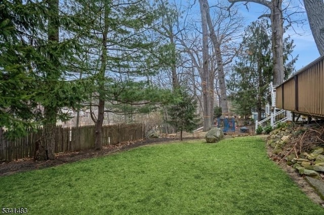 view of yard featuring fence