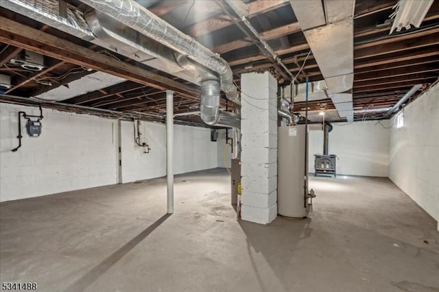 unfinished below grade area featuring gas water heater