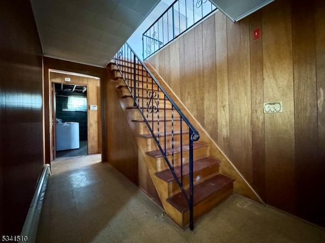 stairway with wood walls