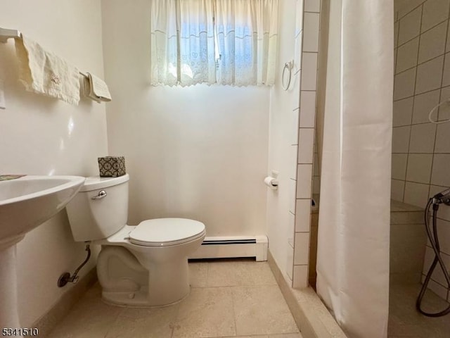 full bathroom with a baseboard radiator, a tile shower, toilet, and tile patterned floors