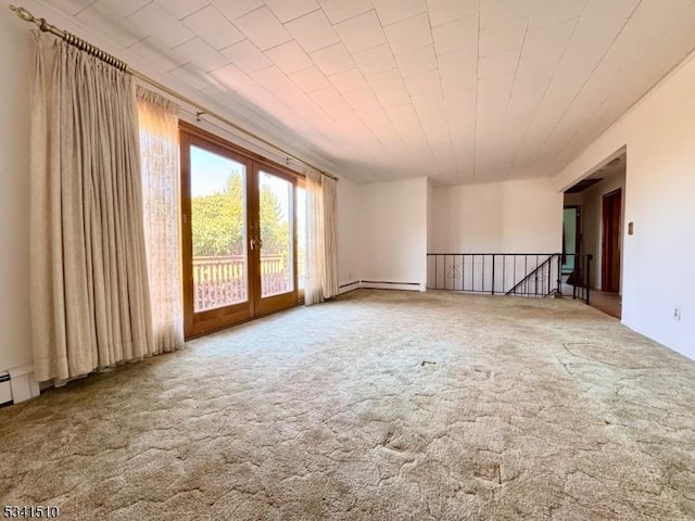 unfurnished room featuring carpet flooring and french doors