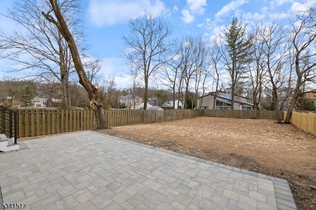 view of yard featuring a fenced backyard and a patio area