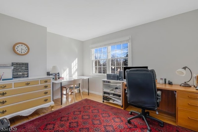 office featuring light wood finished floors and baseboards