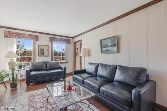 living room featuring crown molding and wood finished floors