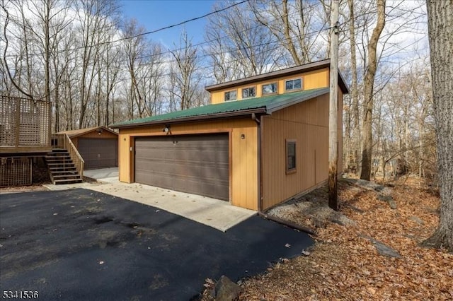 garage featuring driveway