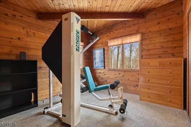 workout area featuring carpet flooring, wood ceiling, and wooden walls