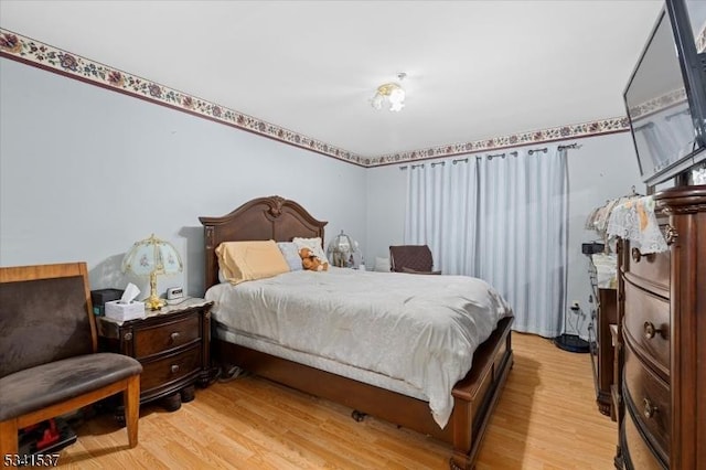 bedroom featuring light wood-type flooring