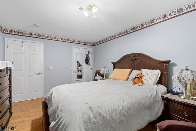 bedroom featuring wood finished floors