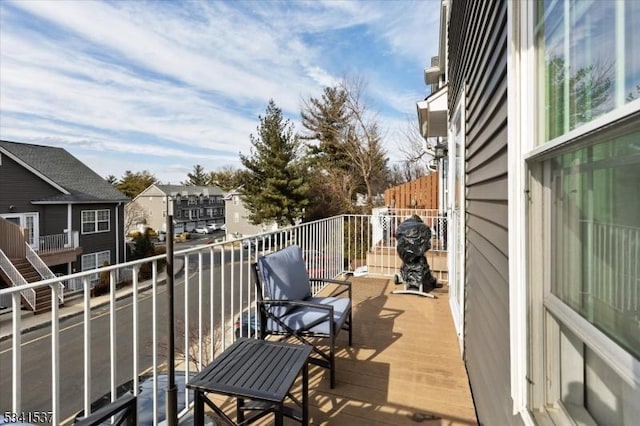 wooden terrace featuring a residential view