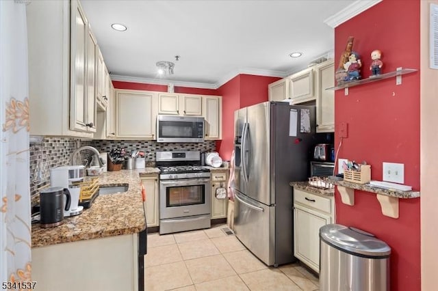 kitchen with stainless steel appliances, light tile patterned flooring, a sink, and backsplash