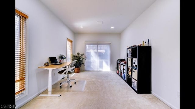 carpeted office space with recessed lighting