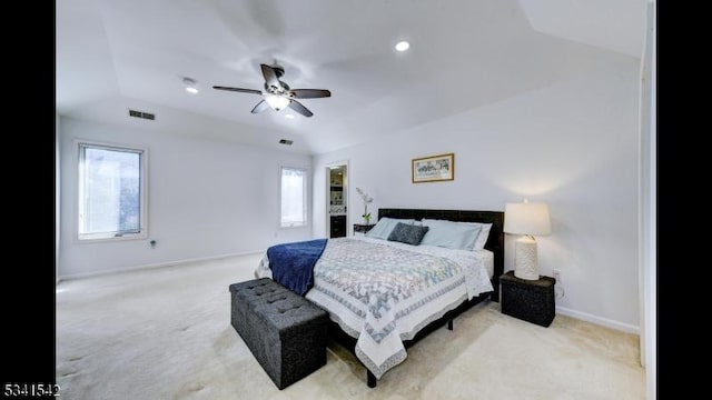 carpeted bedroom featuring baseboards, multiple windows, and visible vents