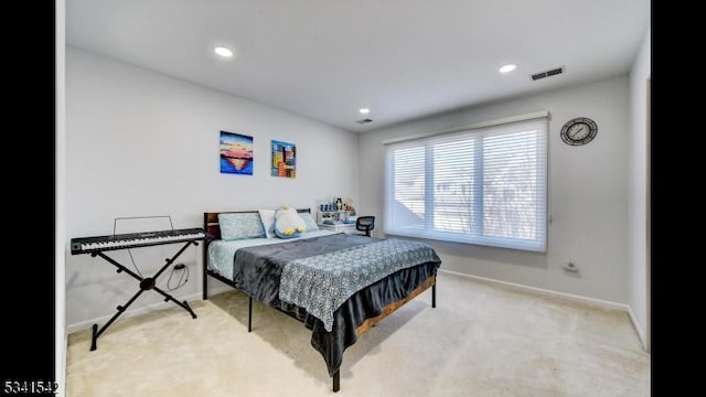 carpeted bedroom with recessed lighting, visible vents, and baseboards