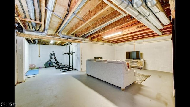 living area with concrete flooring