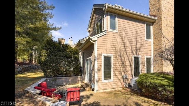 rear view of house with a chimney