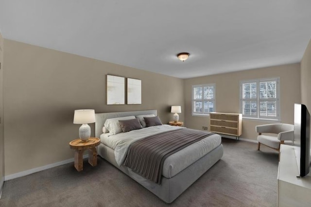 bedroom featuring carpet flooring and baseboards