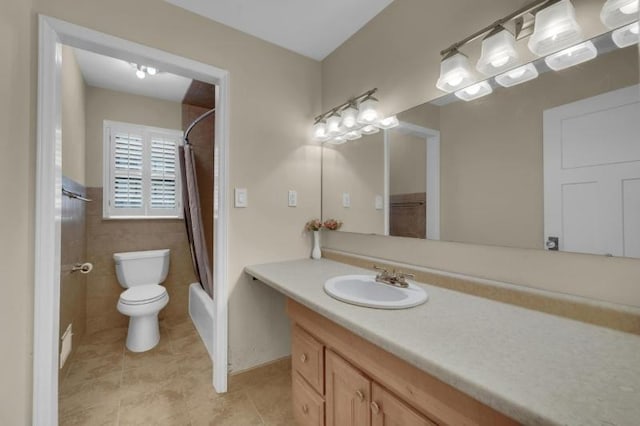 full bathroom featuring vanity, tile patterned flooring, tile walls, toilet, and shower / tub combo with curtain