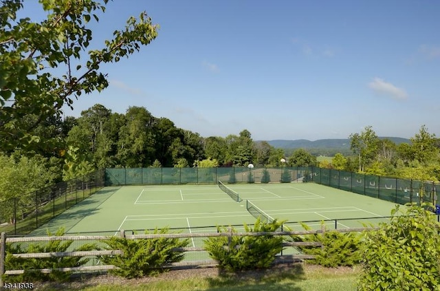 view of sport court with fence