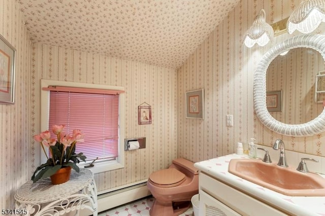 half bathroom with toilet, wallpapered walls, a baseboard radiator, and vanity