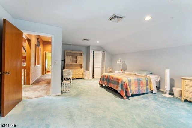 carpeted bedroom featuring visible vents, vaulted ceiling, a closet, and recessed lighting