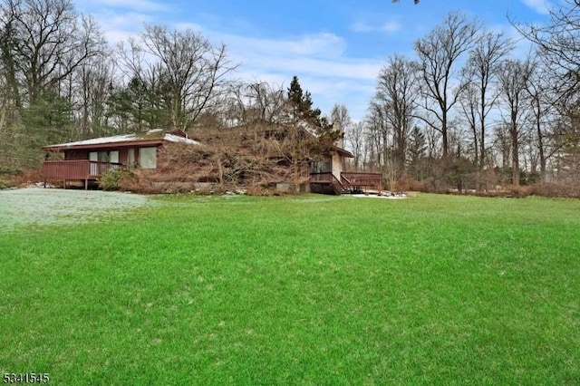 view of yard featuring a wooden deck