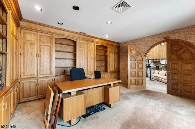 office space with visible vents, arched walkways, light colored carpet, ornamental molding, and recessed lighting