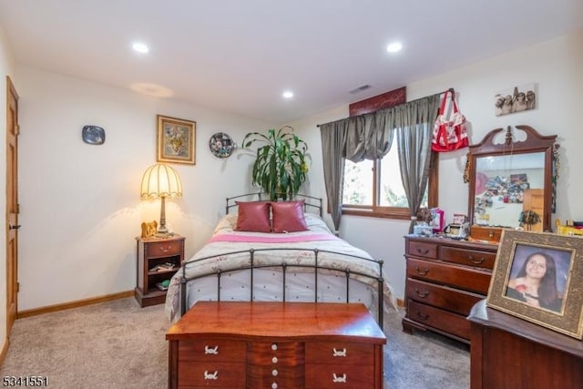 bedroom featuring recessed lighting, light colored carpet, visible vents, and baseboards