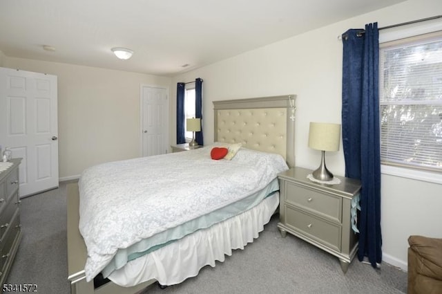 carpeted bedroom with baseboards