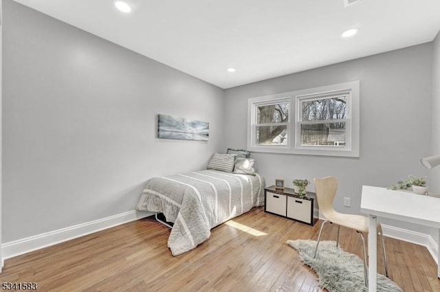 bedroom with recessed lighting, baseboards, and hardwood / wood-style floors