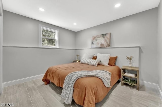 bedroom with recessed lighting and baseboards