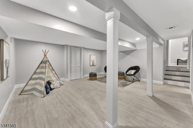 recreation room featuring baseboards, visible vents, wood finished floors, and recessed lighting