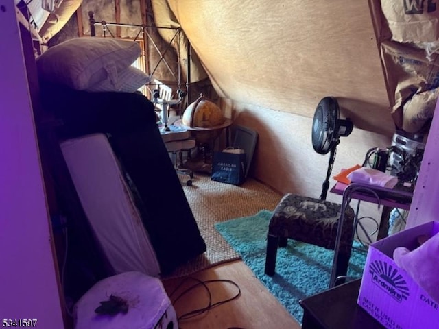 interior space with lofted ceiling and carpet flooring