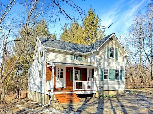 traditional home featuring covered porch