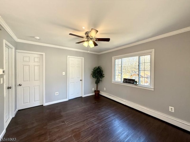 unfurnished bedroom featuring crown molding, dark wood finished floors, a baseboard heating unit, ceiling fan, and baseboards