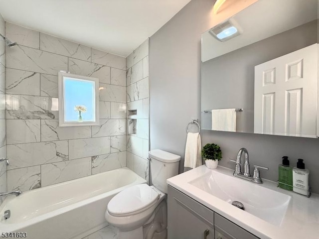 full bath with marble finish floor,  shower combination, vanity, and toilet