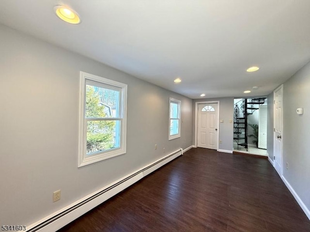 foyer entrance featuring a baseboard radiator, recessed lighting, baseboards, stairs, and dark wood-style floors