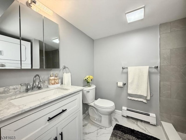 full bathroom with tiled shower, toilet, marble finish floor, baseboard heating, and vanity