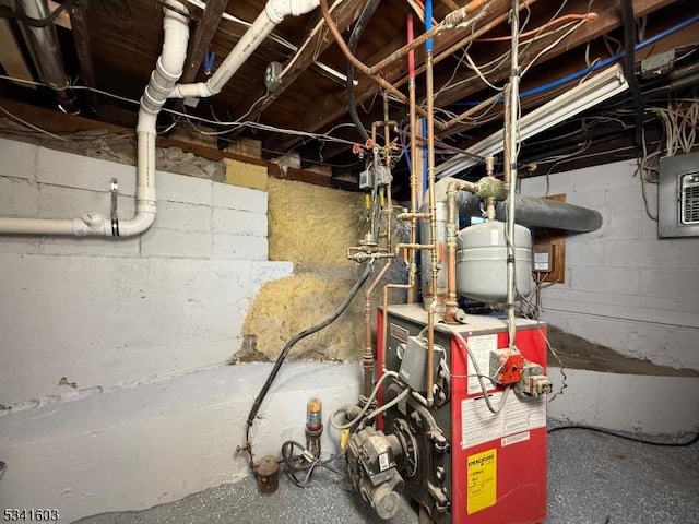 utility room featuring electric panel and a heating unit