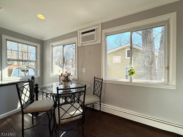 dining area featuring baseboards, dark wood finished floors, a wall unit AC, a baseboard radiator, and ornamental molding