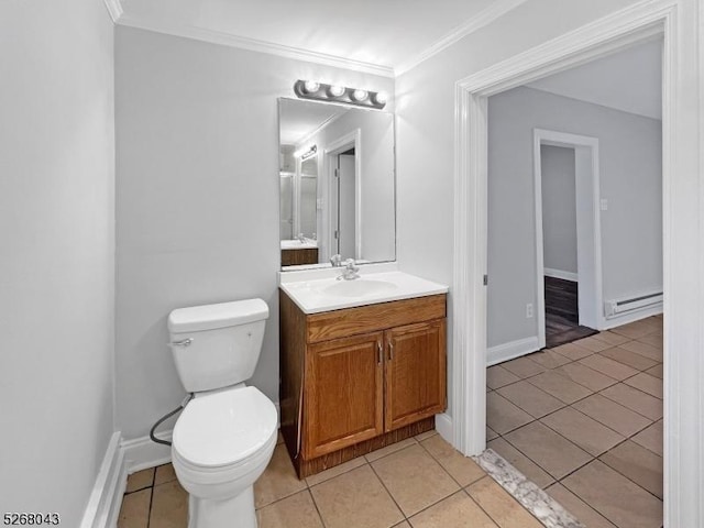 bathroom with toilet, a baseboard heating unit, ornamental molding, and tile patterned floors