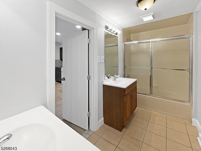 full bathroom featuring bath / shower combo with glass door, crown molding, vanity, and tile patterned floors