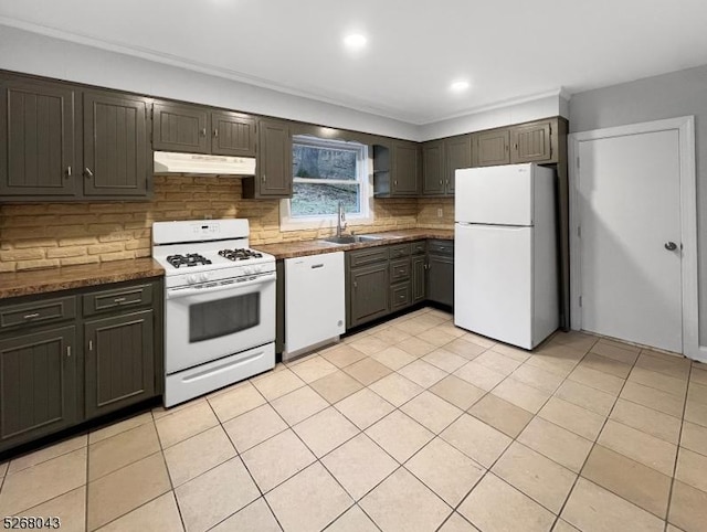 kitchen featuring light tile patterned flooring, under cabinet range hood, white appliances, a sink, and backsplash