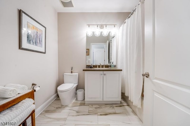 bathroom with toilet, vanity, visible vents, baseboards, and marble finish floor