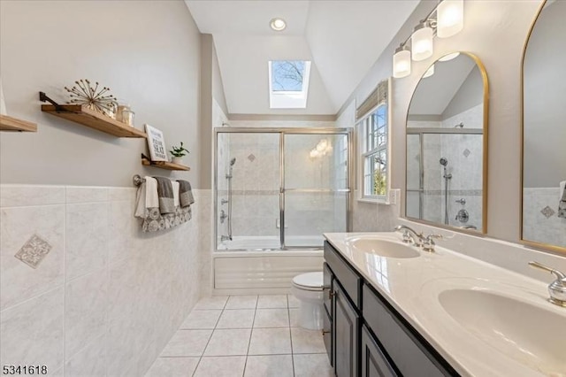 full bath featuring tile patterned flooring, a healthy amount of sunlight, and a sink