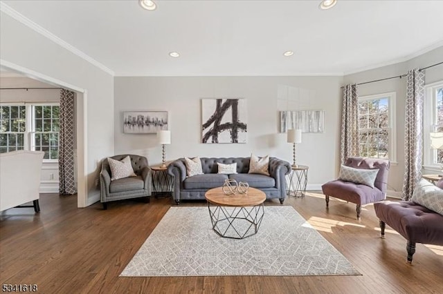 living room featuring baseboards, ornamental molding, dark wood-style flooring, and recessed lighting