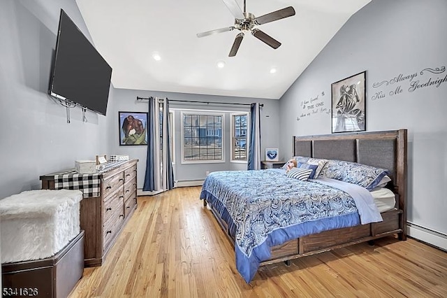 bedroom with lofted ceiling, a baseboard radiator, a baseboard heating unit, a ceiling fan, and light wood-style floors