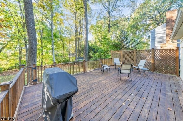 wooden deck with grilling area